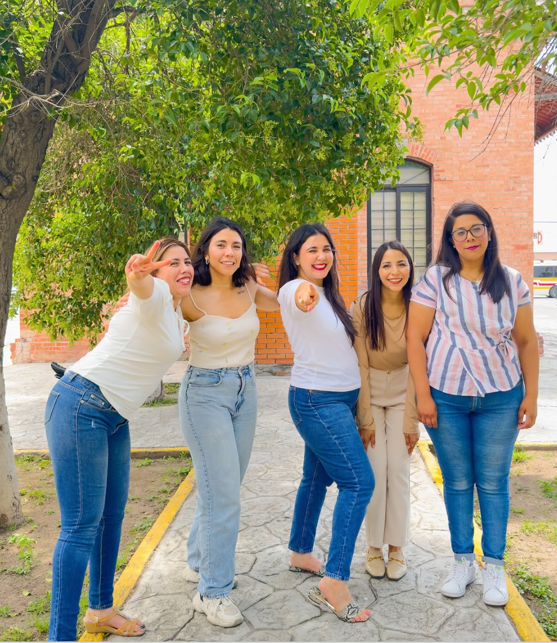 Angela today, center, pointing, with her sisters